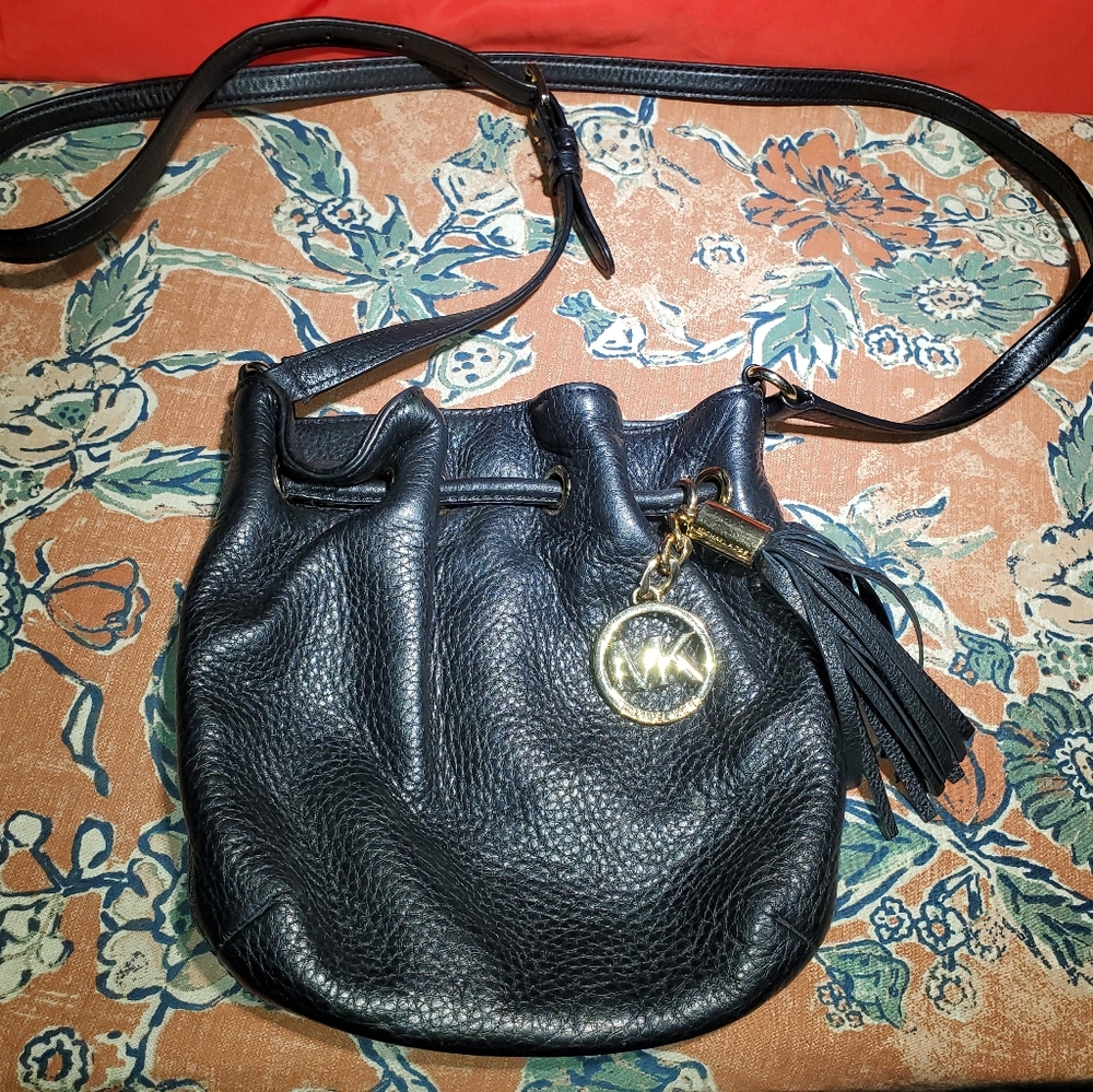 Michael Kors mini Crossbody.  Black Pebbled leather. Gold hardware.